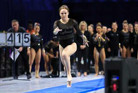 Phoebe Turner, a British gymnast at Iowa State University, runs down the vault track at a competition