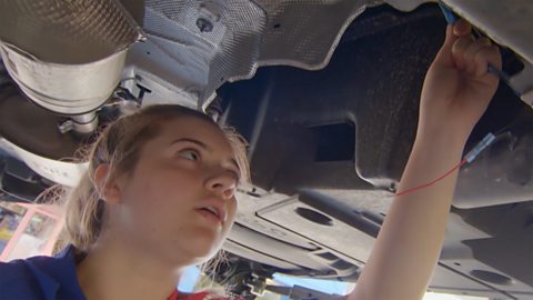 Allina working as a mechanic