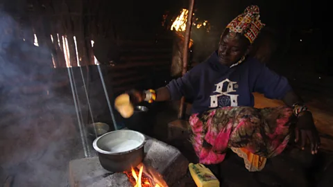Jacob Kushner Ng’iro Neepe milks her camels by hand before boiling the rich, sweet-tasting liquid over a small fire to prepare chai (Credit: Jacob Kushner)
