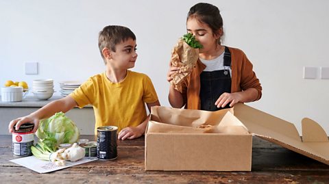 Kids opening a Cook School recipe box