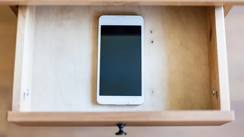 Alamy It's possible to simply turn off your phone and stick it in a drawer for a bit – you don't have to text back right way (Credit: Alamy)