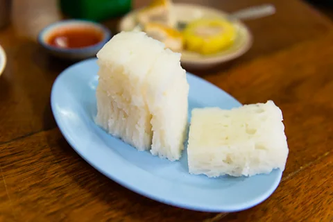Austin Bush Paa thawng ko, a cake of fermented rice flour, is one of the many Chinese dishes incorporated into Trang's breakfast fare (Credit: Austin Bush)