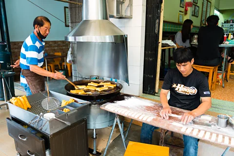 Austin Bush Kun Chiang Bang Rak is one of many places in Trang serving Cantonese-style deep-fried dough for breakfast (Credit: Austin Bush)