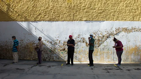 Getty Images Voters in a socially distanced queue in Caracas (Credit: Getty Images)