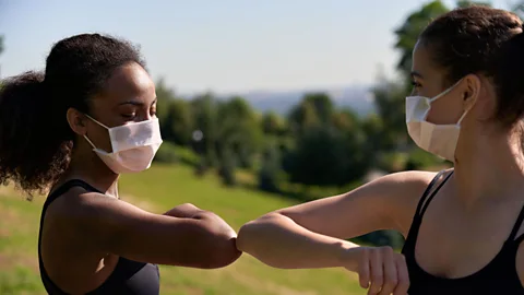 Alamy Elbow bumps as greetings may stay as many are finding it awkward to ease back into hugs and other types of physical contact the pandemic has suspended (Credit: Alamy)