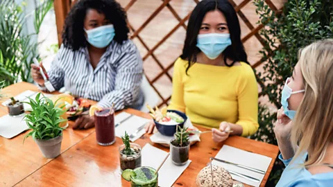 Alamy In countries in which the virus is under control, masked socialising is helping things feel like they're returning to normal (Credit: Alamy)