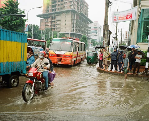 Michael Hall/Getty Images In the past three decades Bangladesh has braved more than 200 natural disasters, and climate change is set to make flooding worse (Credit: Michael Hall/Getty Images)