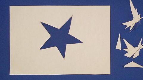 A star hole cut out of paper