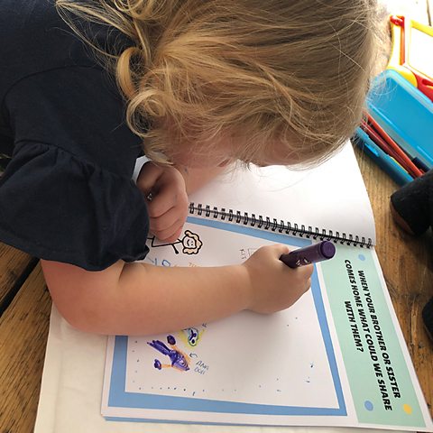 Molly's daughter working through an adoption preparation workbook.