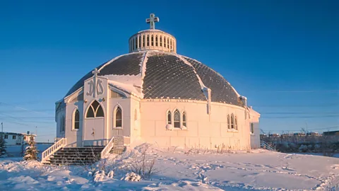 Alamy Our Lady of Victory church in Inuvik has a smart design, but the melting ground is causing problems (Credit: Alamy)