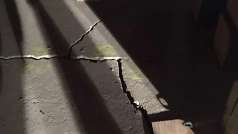 Joe Lavoie A growing crack in the foundations beneath the Our Lady of Victory church (Credit: Joe Lavoie)