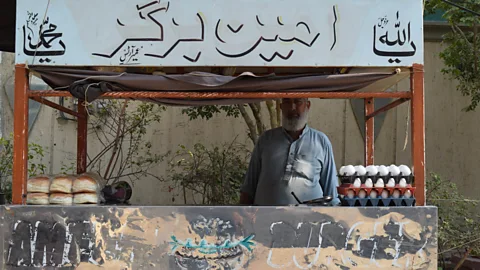 Saqib Rafique Abdul Ameen has been making and selling bun-kebabs in Karachi for 30 years (Credit: Saqib Rafique)