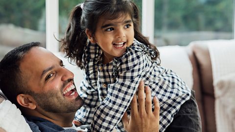 Father and daughter play together