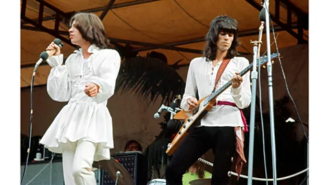 Getty Images An icon of hetero-masculinity in the 1960s, Mick Jagger wore a dress by designer Mr Fish on stage (Credit: Getty Images)