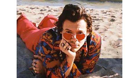 SME/ Columbia Records/ Pulse Recording In the video for Watermelon Sugar, Styles sports playful sunglasses and an androgynous look (Credit: SME/ Columbia Records/ Pulse Recording)