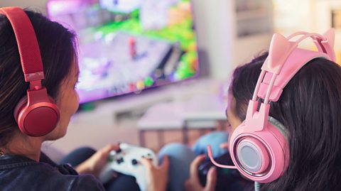 Mother and daughter playing a video game