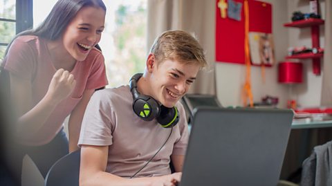 Brother and sister playing video games