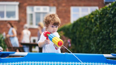 A child using a water gun