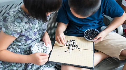 Getty Images Children play Go (Credit: Alamy)