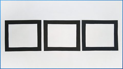 Three identical black frames in a row, made from card.