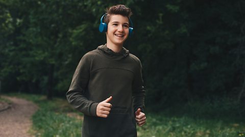 Teenage boy out running in nature