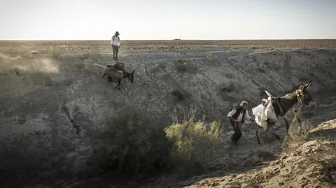 John Stanmeyer/National Geographic In remote Uzbekistan, Paul Salopek and his guide traversed a Silk Road wilderness that hadn't seen foot travellers for generations (Credit: John Stanmeyer/National Geographic)