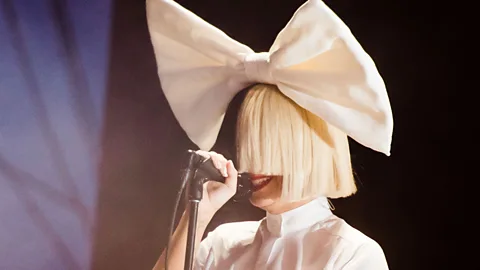 Getty Images Sia has used an oversized wig to create a certain distance in her public image (Credit: Getty Images)