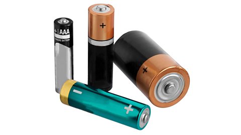 Four alkaline batteries of different sizes