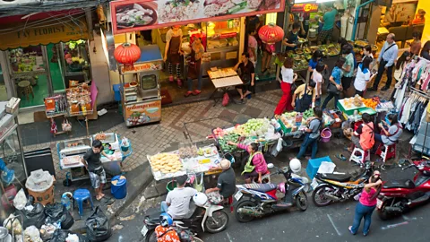 Alamy Bangkok's busy commercial areas, with local stores and street food vendors, help facilitate shared streets (Credit: Alamy)