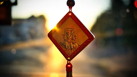Alamy Lucky charms – or talismans – are relatively common in Taiwanese society, like this one in a car (Credit: Alamy)