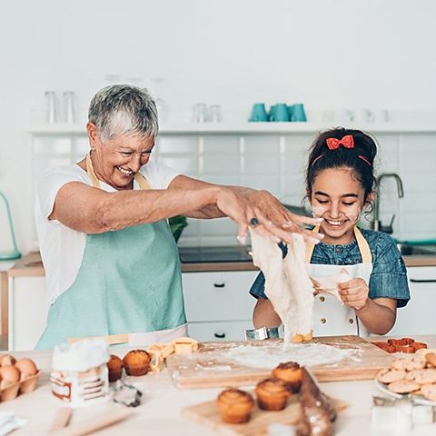 photograph of granny and grand-daughter baking in a kitchen