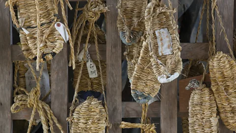 BSPI/Getty Images Pilgrims traditionally wear straw sandals and must walk in silence for the duration of their training (Credit: BSPI/Getty Images)