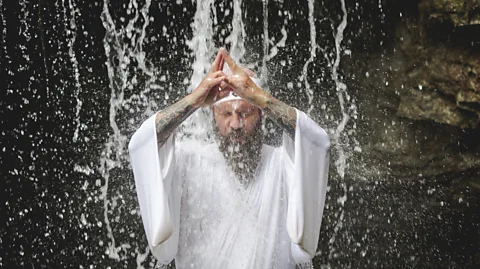Westend61/Getty Images Meditation under a waterfall is among the rituals required to become a certified Yamabushi (Credit: Westend61/Getty Images)