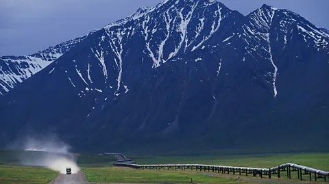 Paul A Souders/Getty Images The Brooks Range looms over sections of the loose-gravel highway (Credit: Paul A Souders/Getty Images)