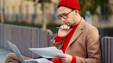 Alamy Man on a bench, thinking