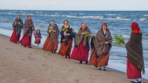 Aldis Pinkens The small remaining Livonian population celebrates its heritage through traditional dress, ceremonies and music (Credit: Aldis Pinkens)