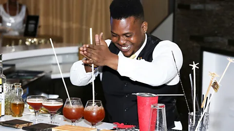 Sean Drakes/Getty Images Bartender Kishion Guillaume of Trinidad & Tobago creates original cocktails at the Angostura Global Cocktail Challenge (Credit: Sean Drakes/Getty Images)