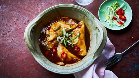 Braise simple egg dumplings in chilli sauce for a moreish meal.