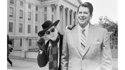 Mike Maloney/Mirrorpix/Getty Images Frankie Goes to Hollywood frontman Holly Johnson posing outside the White House with a full-size cut-out of Ronald Reagan in 1984 (Credit: Mike Maloney/Mirrorpix/Getty Images)