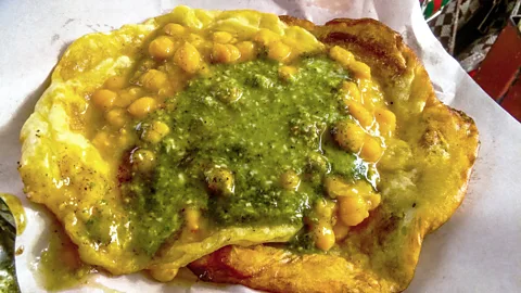 Barry Ramkissoon/Getty Images Doubles is a sandwich made from curried chickpeas tucked between two pieces of fried flat bread (Credit: Barry Ramkissoon/Getty Images)