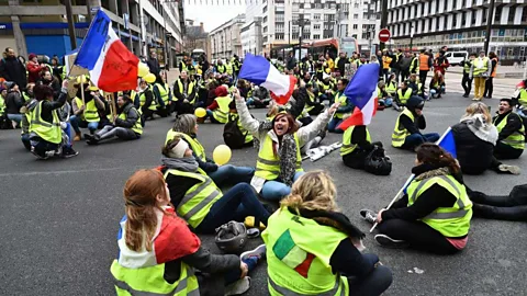 Jean-Francois Monier/Getty Images Women wearing a yellow vest (gilet jaune) stage a protest in France (Credit: Jean-Francois Monier/Getty Images)