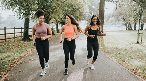 Three girls jogging in a park