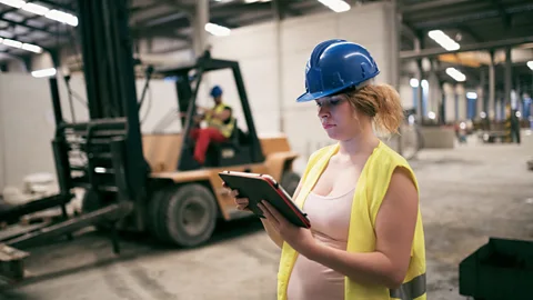 Getty Workers in blue-collar jobs are less likely to get paid parental leave than those with corporate jobs (Credit: Getty)