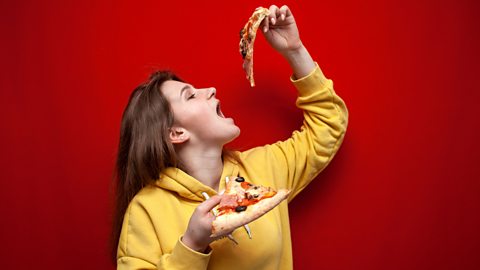 Ultra-processed food and younger people Teenage girls eats pizza