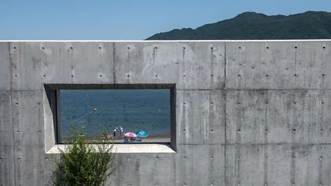 Carl Court/Getty Images …apart from a rare glimpse. The wall is designed to protect Japan's coast from future tsunamis (Credit: Carl Court/Getty Images)