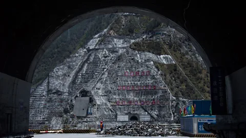 Johannes Eisele/Getty Images Nature, subsumed: towering walls of concrete entomb forests on mountainsides in south-west China, to build a major dam (Credit: Johannes Eisele/Getty Images)