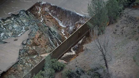 Kelly M. Grow/Getty Images Eroded concrete causes flooding from the Oroville Dam spillway in California (Credit: Kelly M. Grow/Getty Images)