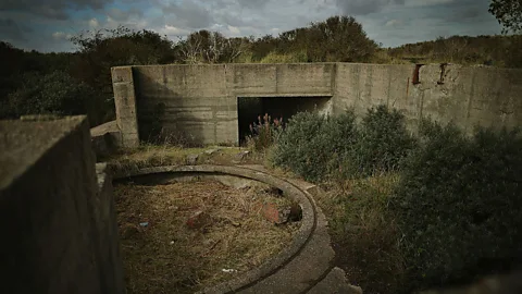 Dan Kitwood/Getty Images Eventually, nature takes back everything: a concrete military bunker is reclaimed by dunes at Spurn Point in Yorkshire, UK (Credit: Dan Kitwood/Getty Images)