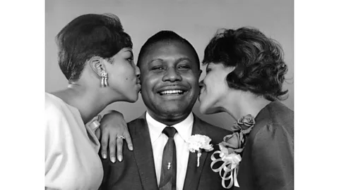 Alamy Aretha (left) and Carolyn (right) with their father, the Rev CL Franklin (Credit: Alamy)