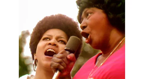 Courtesy of Searchlight Pictures Mahalia Jackson and Mavis Staples sing gospel together at the 1969 concert (Credit: Courtesy of Searchlight Pictures)